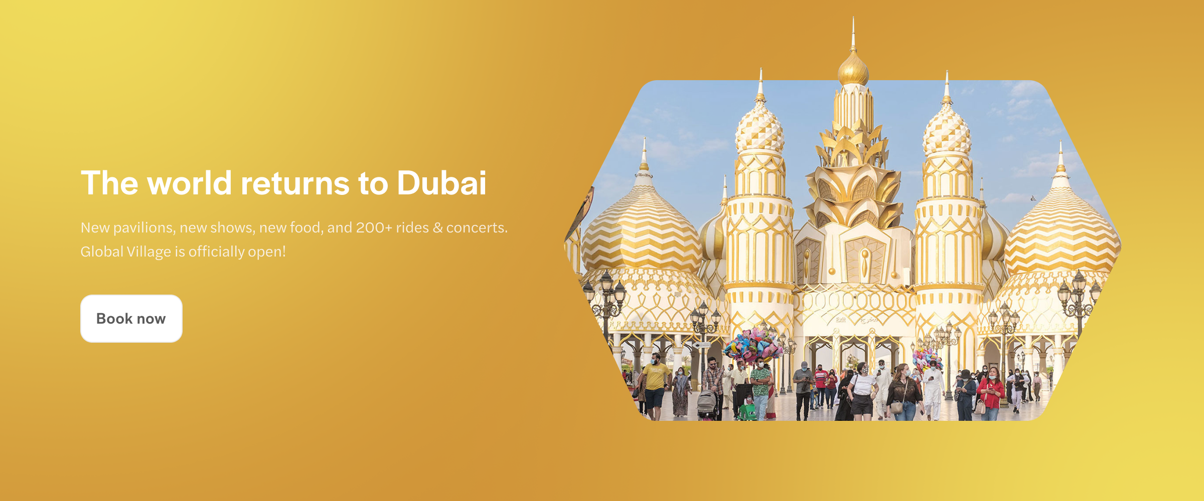 Global Village Dubai entrance with visitors and golden domes.